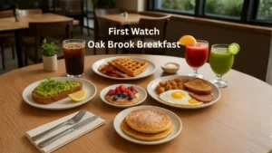 First Watch Oak Brook breakfast display with fluffy pancakes, scrambled eggs, and vibrant fruit arranged on a table.